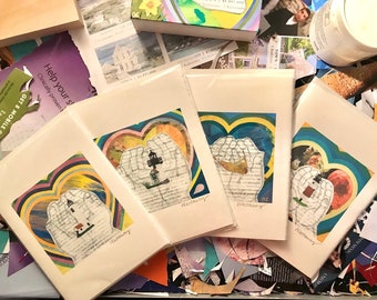May include: Four art prints featuring a heart-shaped design with hands holding a lighthouse, with colorful backgrounds. The prints are on a white background, with the word "Wattanany" written on the bottom. The prints are surrounded by paper scraps.