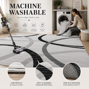 May include: A machine-washable area rug with a modern design. The rug features a gray background with black and gray curved lines. The text "MACHINE WASHABLE" is at the top. The rug is 0.4 inches thick and has a non-slip backing.