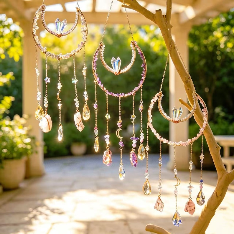 May include: Three crescent moon suncatchers featuring gold-toned metal frames, clear and colored crystal beads, small metal moon charms, and dangling faceted glass pendants. Each piece includes a central iridescent crystal point at the top.