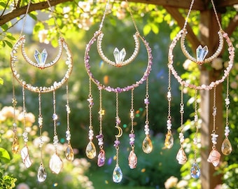 May include: Three hanging crescent moon ornaments made of gold-toned metal wire, each featuring a central crystal point, small gemstone beads along the frame, and dangling chains with faceted glass drops and additional gemstone accents.