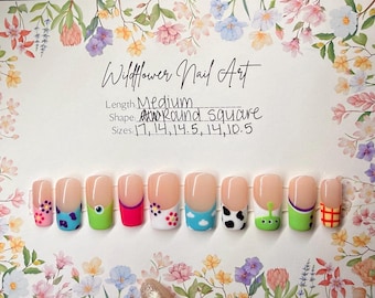 Cowboy, Space Ranger, and Alien toy French tip press ons - Blue and purple monster, green cyclops, door with flowers press on nails