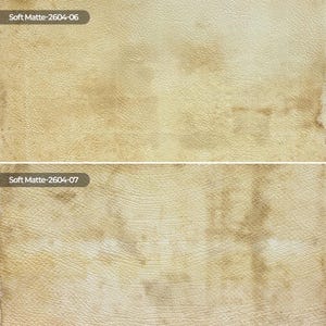 May include: A split-screen view of two textured surfaces with a beige and tan mottled pattern. The top section is labeled Soft Matte-2604-06 and the bottom section is labeled Soft Matte-2604-07, both displaying a leather-like grain appearance.