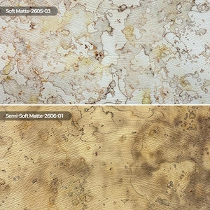 May include: Two textured material samples. The top sample, labeled Soft Matte-2605-03, is white with irregular brown and tan watercolor-like stains. The bottom sample, labeled Semi-Soft Matte-2606-01, is tan with darker brown mottled patterns.