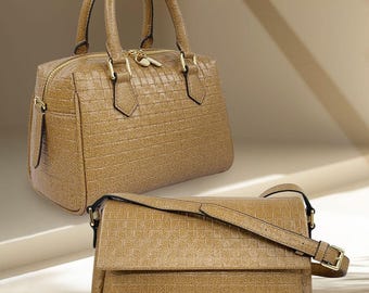 May include: Two brown leather handbags. One is a structured satchel with top handles and a zipper closure. The other is a rectangular crossbody bag with a flap and adjustable strap. Both bags have a textured pattern and gold-tone hardware. The bags are labeled "Coffee Leather".