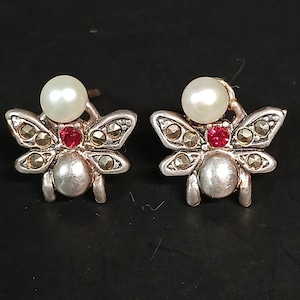 May include: A set of three ceramic mugs with a speckled, matte finish. The mugs are in shades of cream, light gray, and dark gray. Each mug has a simple, minimalist design, perfect for coffee or tea.