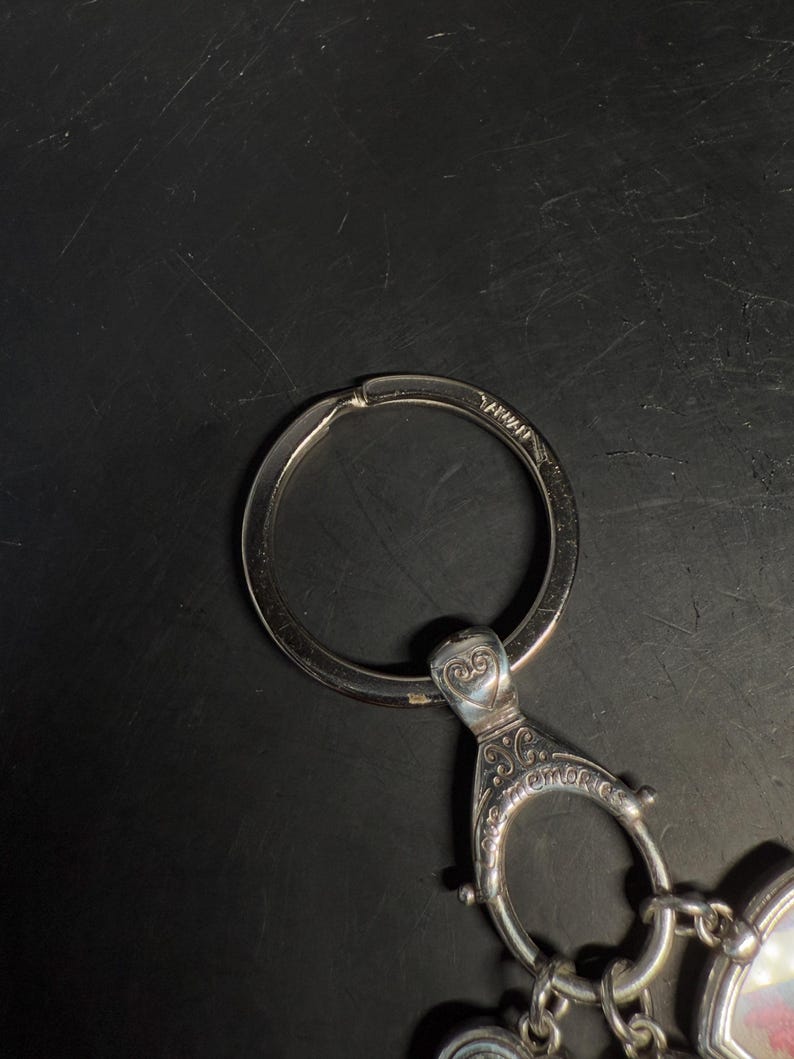 May include: A white ceramic mug with a black handle and the text "But First, Coffee" in a black, bold font. The mug is on a white surface.