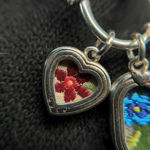 May include: A set of three ceramic mugs with a speckled, matte finish. The mugs are in shades of cream, light gray, and dark gray. Each mug has a simple, minimalist design, perfect for coffee or tea.