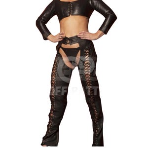 May include: A black long-sleeve cropped top and matching chaps set. The top features a front lace-up closure. The chaps have a high-waisted belt with a lace-up front and full-length lace-up detailing along the outer legs, paired with black underwear.