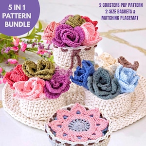 May include: A collection of handmade crochet items, including baskets and placemats, adorned with colorful crochet flowers in shades of pink, purple, blue, and green. The image includes text that reads "5 IN 1 PATTERN BUNDLE" and "2 COASTERS PDF PATTERN 2-SIZE BASKETS & MATCHING PLACEMAT."