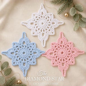 May include: Three crocheted star ornaments in white, light blue, and soft pink. Each star features a central circular design with pointed edges and a small loop at the top. Text reads: The DIAMOND STAR CROCHET PATTERN, EASY FOUR ROUNDS.