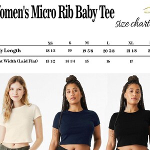 May include: A size chart for a micro rib baby tee with body length and chest width measurements in inches for sizes XS through 2XL. Below the chart are three short-sleeved, crew neck baby tees in cream, navy blue, and black colors.