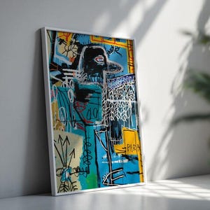 May include: Abstract art print in a white frame. The artwork features a black figure with a red eye, set against a vibrant background of blue, yellow, and white. The piece has a graffiti-like style with bold lines and shapes.