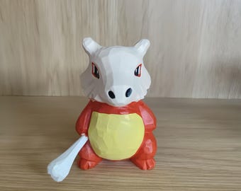 Handcrafted Wooden Dinosaur Figurine: Cubone-Inspired Blackwood Sculpture