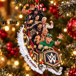 May include: A decorative Christmas ornament featuring a group of WWE wrestlers riding in a festive sleigh. The sleigh is adorned with the WWE logo, red and green holiday accents, and the text The Smiths. The wrestlers include John Cena.