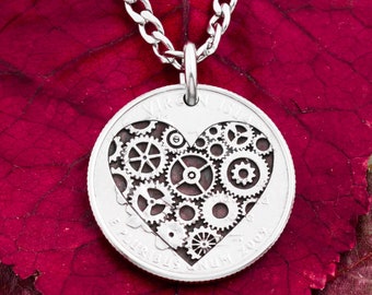 May include: Silver necklace with a silver quarter coin pendant featuring a heart design made of gears. The coin is inscribed "VIRGIN ISLANDS" and "E PLURIBUS UNUM 2003".