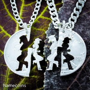 May include: Two silver necklaces with matching pendants. Each pendant is a half-heart cut out of a silver coin. The coins feature the Liberty Bell and the words "In God We Trust".