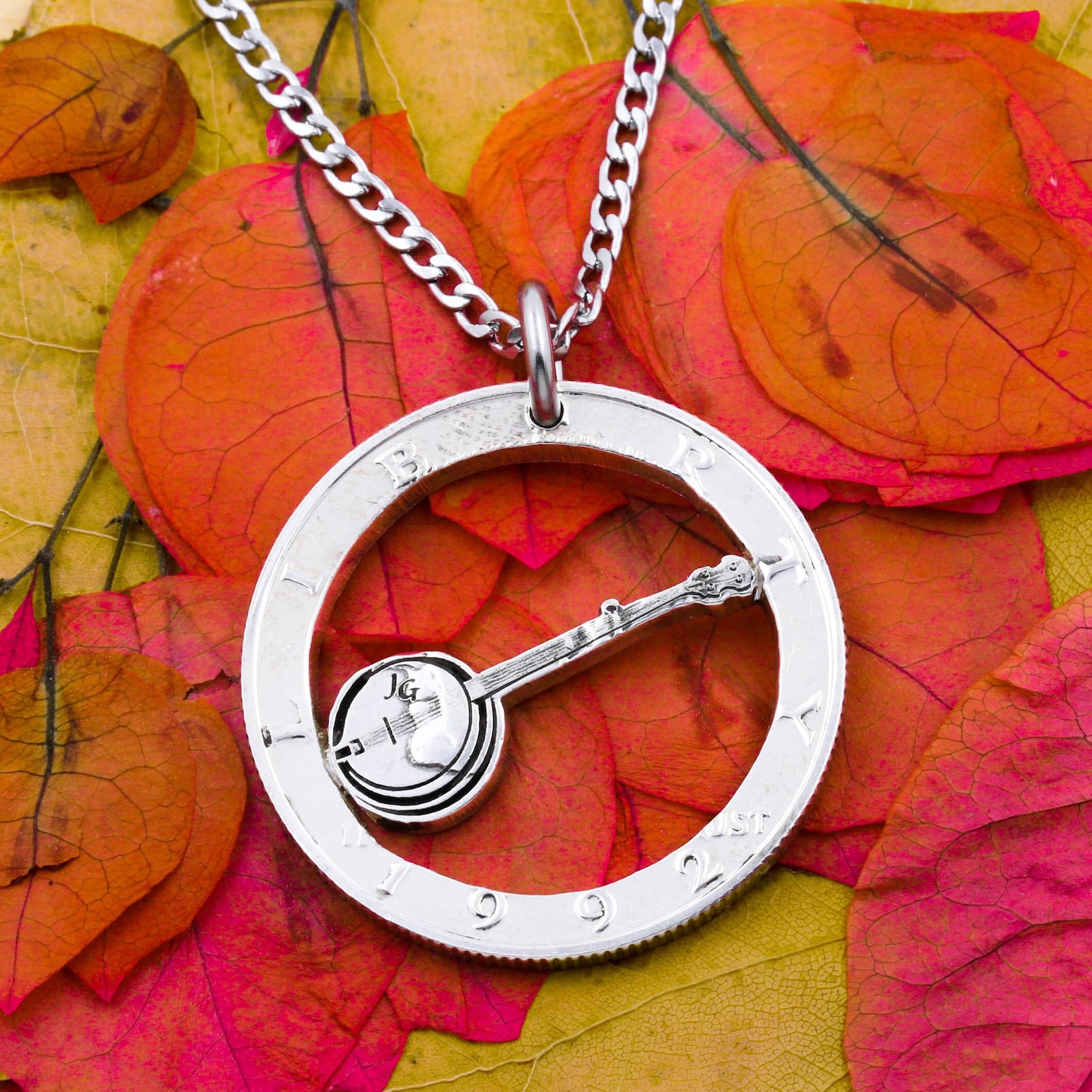 coin necklace with a banjo in the middle