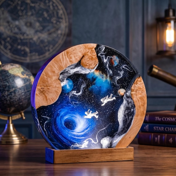 A circular epoxy-wood lamp with a galaxy/black-hole diorama trapped inside — like a tiny cosmos sitting on your desk glowing at 2am.