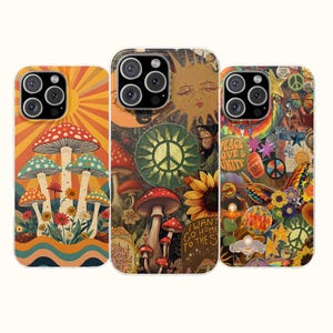 May include: Three colorful phone cases with retro designs. One features mushrooms and a sunburst, another has a sun, mushrooms, and a peace sign, and the third displays butterflies and the words "Peace Love Unity."