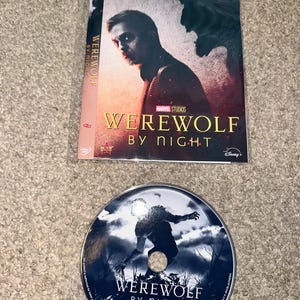 May include: A Marvel Studios Werewolf by Night DVD featuring a cover with Gael García Bernal and a disc with a silhouette of a werewolf against a full moon. The cover includes the title Werewolf by Night, the Disney+ logo, and a Movie Rewards star.