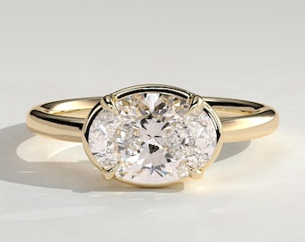 Oval öst-väst Bezel-ram Solitaire-ringkorgset Ovalslipad moissanitförlovningsring 18k gult guld Frieri-ring med 4 klor