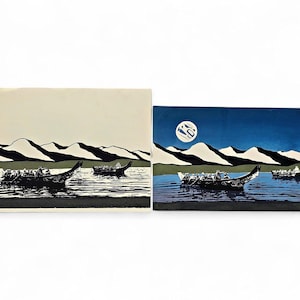 May include: Two landscape paintings depicting boats on water with mountains in the background. One painting has a beige sky, the other a dark blue sky with a moon. The boats are black, and the water is a dark blue.
