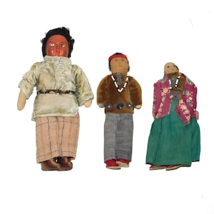 May include: A set of three ceramic mugs with a speckled, matte finish. The mugs are in shades of cream, light gray, and dark gray. Each mug has a simple, minimalist design, perfect for coffee or tea.