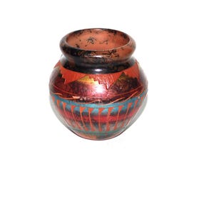 May include: A small, round, hand-painted pottery vase with a black, red, orange, blue, and turquoise geometric design.
