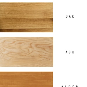 May include: Image showcasing three wood species: oak, ash, and alder. The oak sample is a light brown with a straight grain pattern. Ash is a lighter, beige wood with a wavy grain. Alder is a reddish-brown wood with a straight grain. Text at the top reads "TYPES OF WOOD SPECIES."