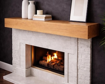 May include: A contemporary fireplace with a light stone surround and a wooden mantelpiece. The fireplace has a fire burning inside, with decorative vases, books, a candle, and a framed picture on the mantelpiece. The hearth is made of the same stone.