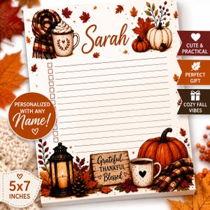 May include: A personalized notepad featuring a fall theme with autumn leaves, pumpkins, a plaid scarf, a mug of cocoa, and a lantern. The top displays the name Sarah, and the bottom includes a wooden sign with the text Grateful Thankful Blessed.