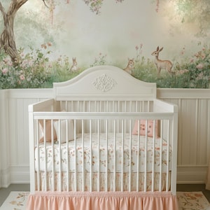 May include: A white cot with a floral patterned sheet and a pink ruffled cot skirt. The nursery features a mural of a forest scene with deer and rabbits, and a matching floral rug.