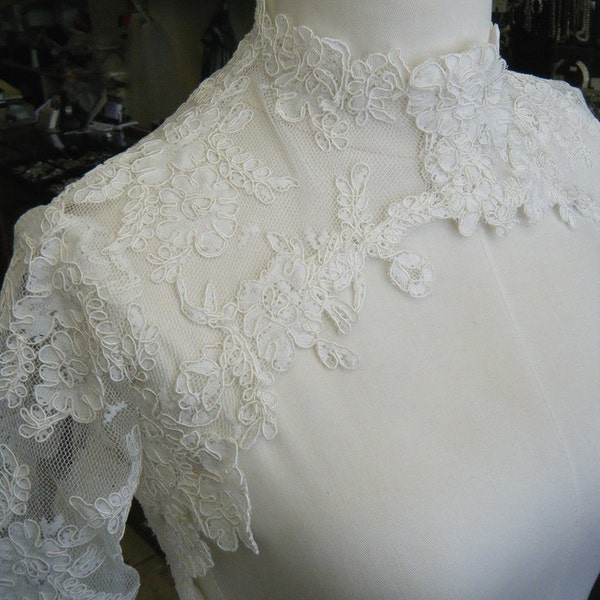 Lace bolero with Couture neck design, three quarter or full length sleeves, available in Ivory, White White or Black lace