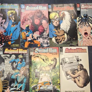 Peut inclure: Une collection de sept bandes dessinées Animal Man présentant diverses illustrations de couverture. Chaque numéro affiche le titre Animal Man en lettres rouges, avec des illustrations représentant des personnages et des scènes surréalistes.