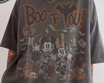 レトロなミッキー＆ミニーのスケルトンハロウィンシャツ、ディズニーランドの「Boo To You」コンフォートカラーズTシャツ、ファン向けの2026年家族旅行ギフトにぴったりの不気味なデザイン