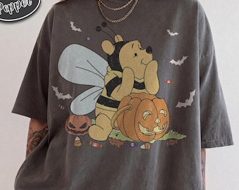 ヴィンテージ風くまのプーさんハロウィンシャツ、コンフォートカラーズ製ビーコスチュームTシャツ、パンプキンキャンディ柄、ディズニーパークの不気味なギフト（女性とファン向け）