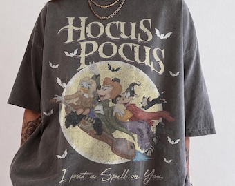 レトロなホーカス・ポーカス ハロウィンシャツ、ミニー、デイジー、クララベル、サンダーソン姉妹のTシャツ、ディズニー スプーキーシーズン コンフォートカラーズ パンプキンパーティー ギフトTシャツ