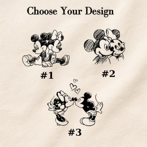 May include: A graphic print featuring the text Choose Your Design at the top. Below are three black ink sketches of cartoon mice characters. Design #1 shows two mice sitting back-to-back. Design #2 shows two mice side-by-side. Design #3 shows two mice kissing with three small hearts above them.