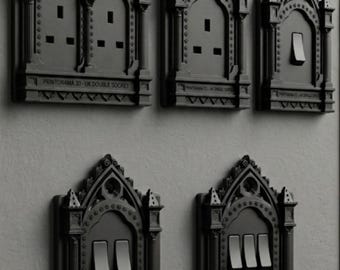 Gotische kathedraal lichtschakelaar en fittingafdekkingen en omlijstingen