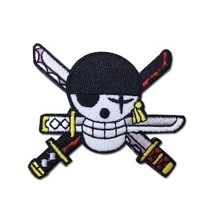 May include: Embroidered patch featuring a white skull with a black eye patch and a black hat. Two crossed swords are behind the skull. The patch has a white background and is likely for clothing or accessories.