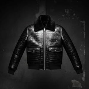 Könnte beinhalten: Schwarze Leder-Bomberjacke mit Kunstfellkragen. Die Jacke hat eine Krokodillederstruktur, einen Frontreißverschluss, zwei Vordertaschen sowie gerippte Bündchen und Saum.