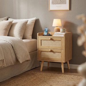 May include: A white ceramic mug with a black handle and the text "But First, Coffee" in a black, bold font. The mug is sitting on a white surface.