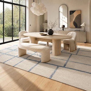 Modern Scandinavian grid rug in beige, cream, and blue with hand tufted craftsmanship for stylish home interiors.