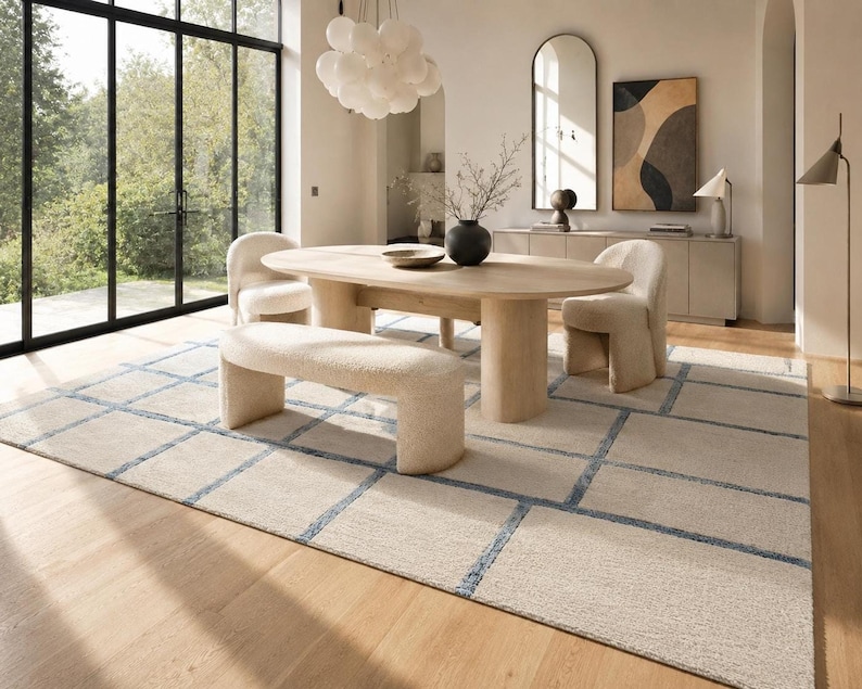 Modern Scandinavian grid rug in beige, cream, and blue with hand tufted craftsmanship for stylish home interiors.