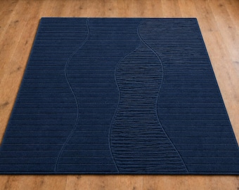 Hand getufteter Wollteppich, abstraktes Wellenmuster in dunklem Denim-Blau, texturierter Luxusteppich