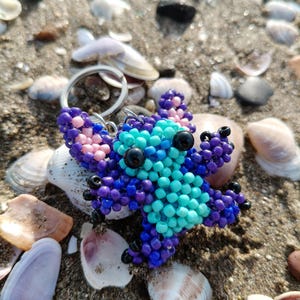 Beaded Keychain ​Stitch Bag Charm ​Handmade Gift ​Disney Fan Art ​Blue Purple Stitch ​Beadwork Animal ​Pixel Art Charm ​Cute Accessory ​Stocking Stuffer ​Lilo and Stitch ​Unique Keychain ​Boho Bag Decor ​Personalized Gift
