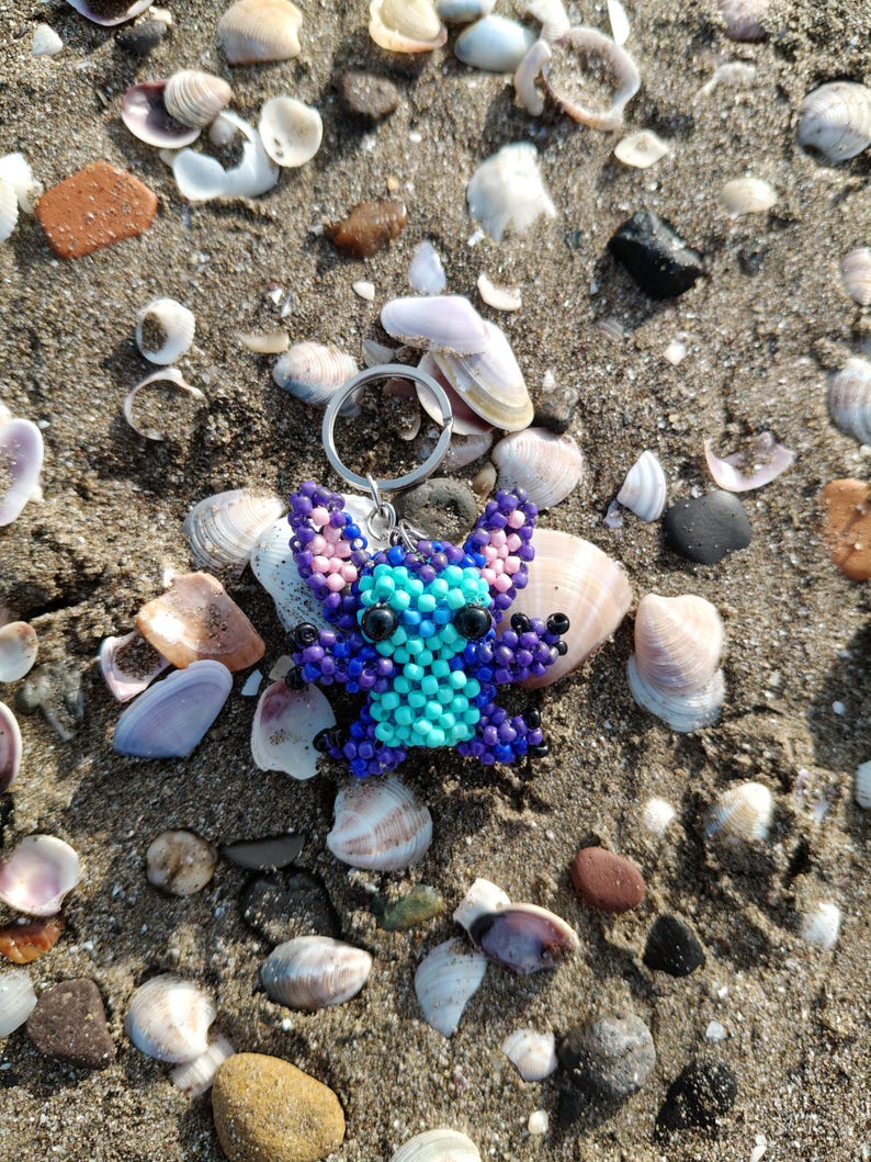 Beaded Keychain ​Stitch Bag Charm ​Handmade Gift ​Disney Fan Art ​Blue Purple Stitch ​Beadwork Animal ​Pixel Art Charm ​Cute Accessory ​Stocking Stuffer ​Lilo and Stitch ​Unique Keychain ​Boho Bag Decor ​Personalized Gift