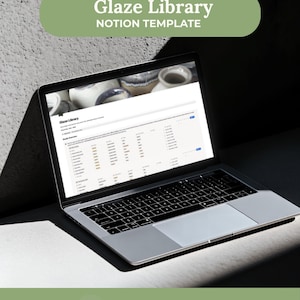 May include: A silver laptop displaying a Glaze Library Notion template on its screen. The text Glaze Library Notion Template appears at the top, and Instant Download Free Notion Plan Mac Windows Phone appears at the bottom.