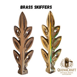 May include: Two brass skiffers in a leaf design. One is aged brass, the other polished. Each has mounting holes. The text "BRASS SKIFFERS" is at the top. The QuenaCraft logo is in the bottom right corner. These are decorative hardware.