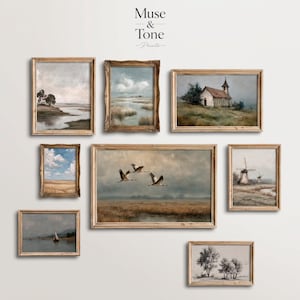 May include: Collection of framed landscape art prints. The prints feature serene scenes of nature, including a river, marsh, church, windmills, and flying birds. The frames are a light brown color, and the art has a vintage aesthetic.